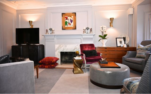 A fireplace anchors the room in warmth.