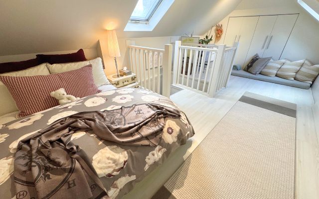 A comfortable third-floor bedroom offering additional private sleeping space.